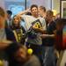 Fans wait in a line wrapped around the the second floor of the M Den in order to meet Michigan football star Desmond Howard during an autograph signing at the M Den on Friday.  Melanie Maxwell I AnnArbor.com